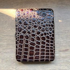 Beautiful brown faux croc wallet with silver clasp.